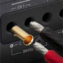 Close up image of four CH ports with a red and black cables entering the holes